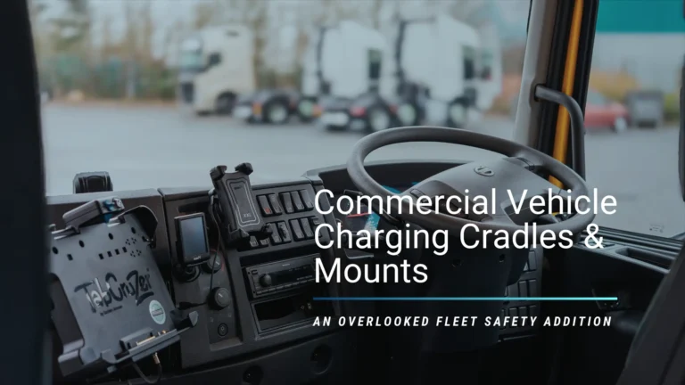 Commercial vehicle dashboard showing professionally installed charging cradles and mounts for mobile devices