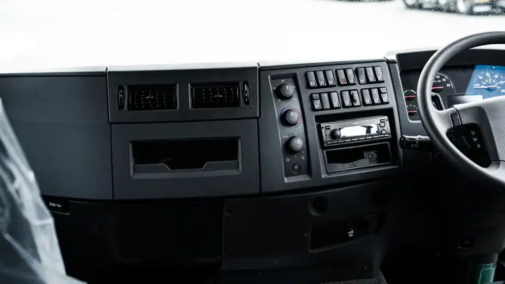Clean factory-standard dashboard of a commercial fleet vehicle before installation.