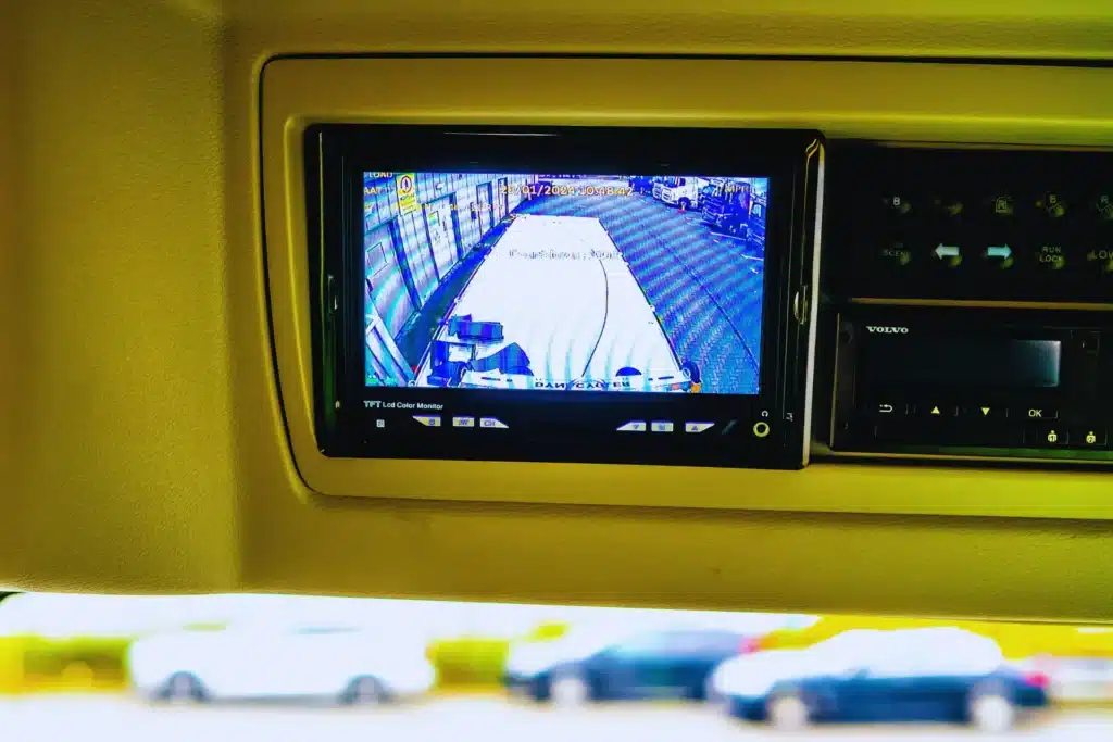 In-cab monitor showing rear view from onboard camera system.