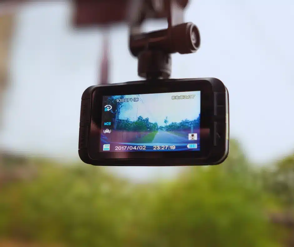  Close-up of a consumer dash cam recording the road ahead.