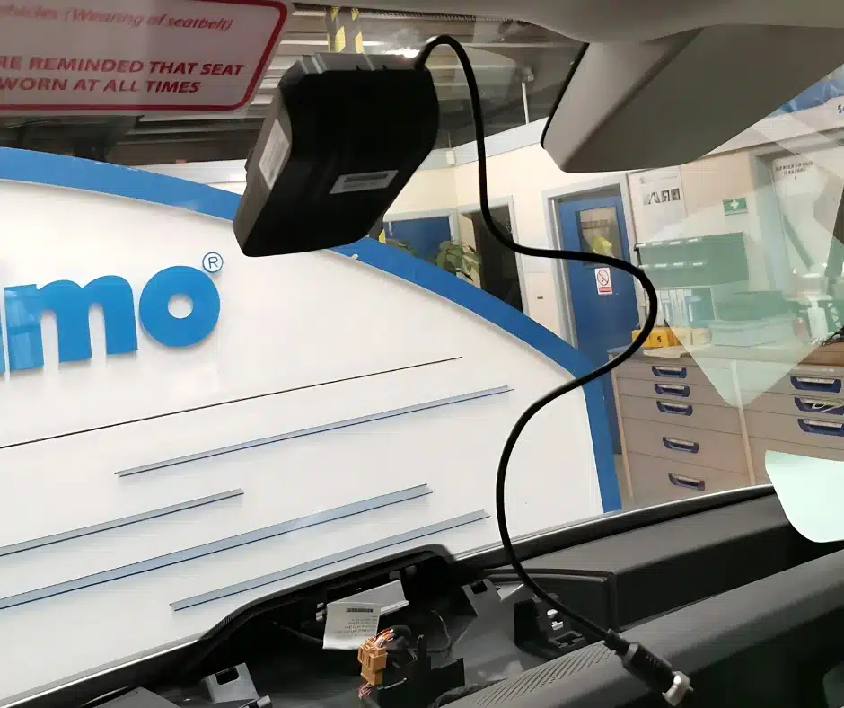Fleet dash cam installation in progress inside a commercial vehicle