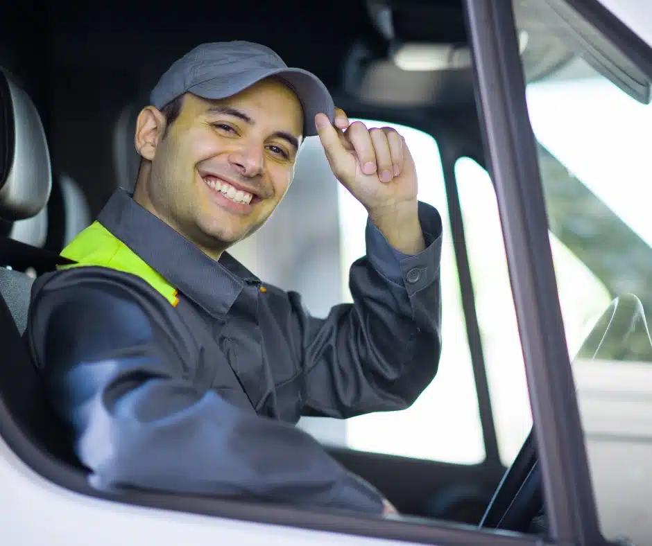 Smiling fleet driver after AI dash cam driver coaching