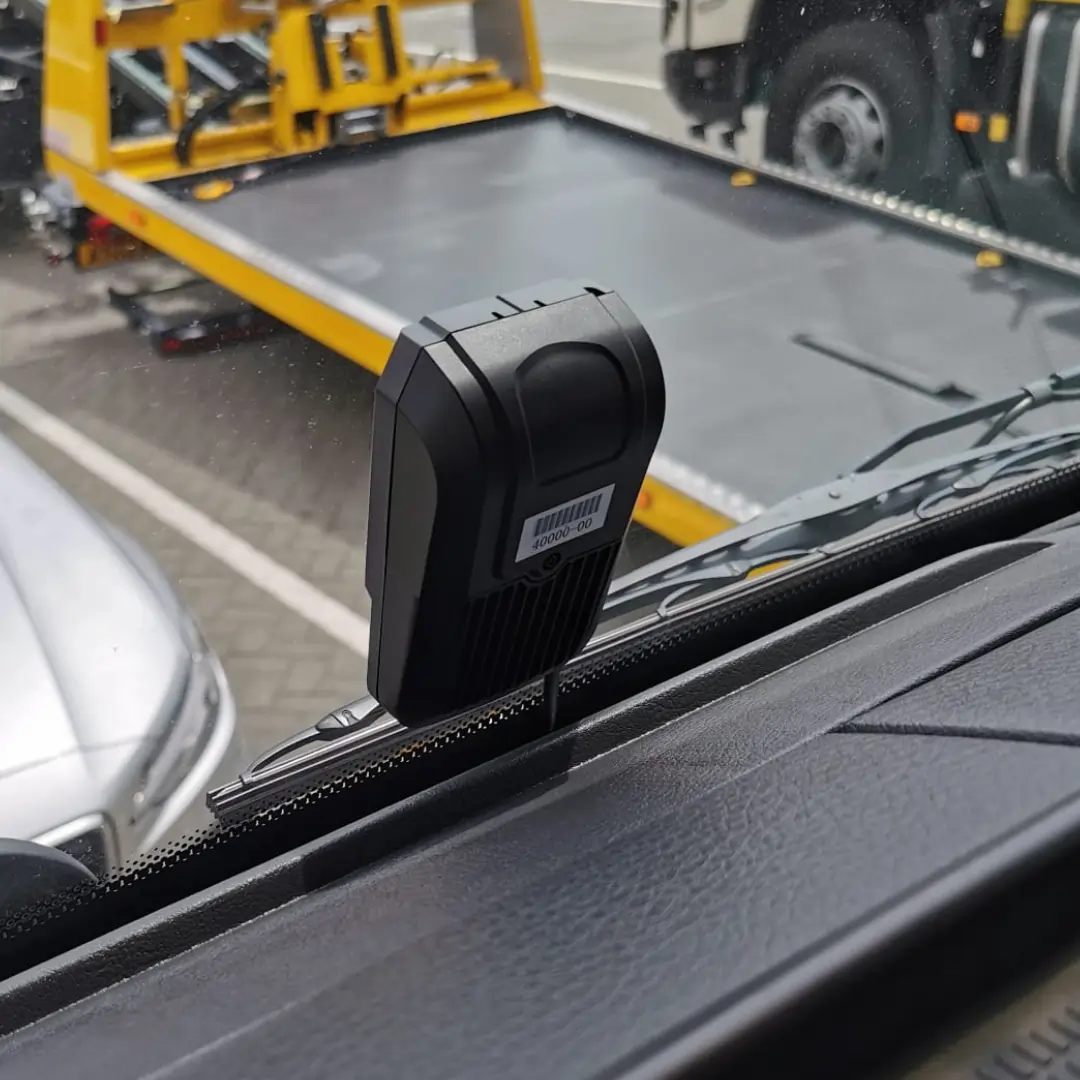 dash camera mounted on a commercial vehicle windshield ready for removal